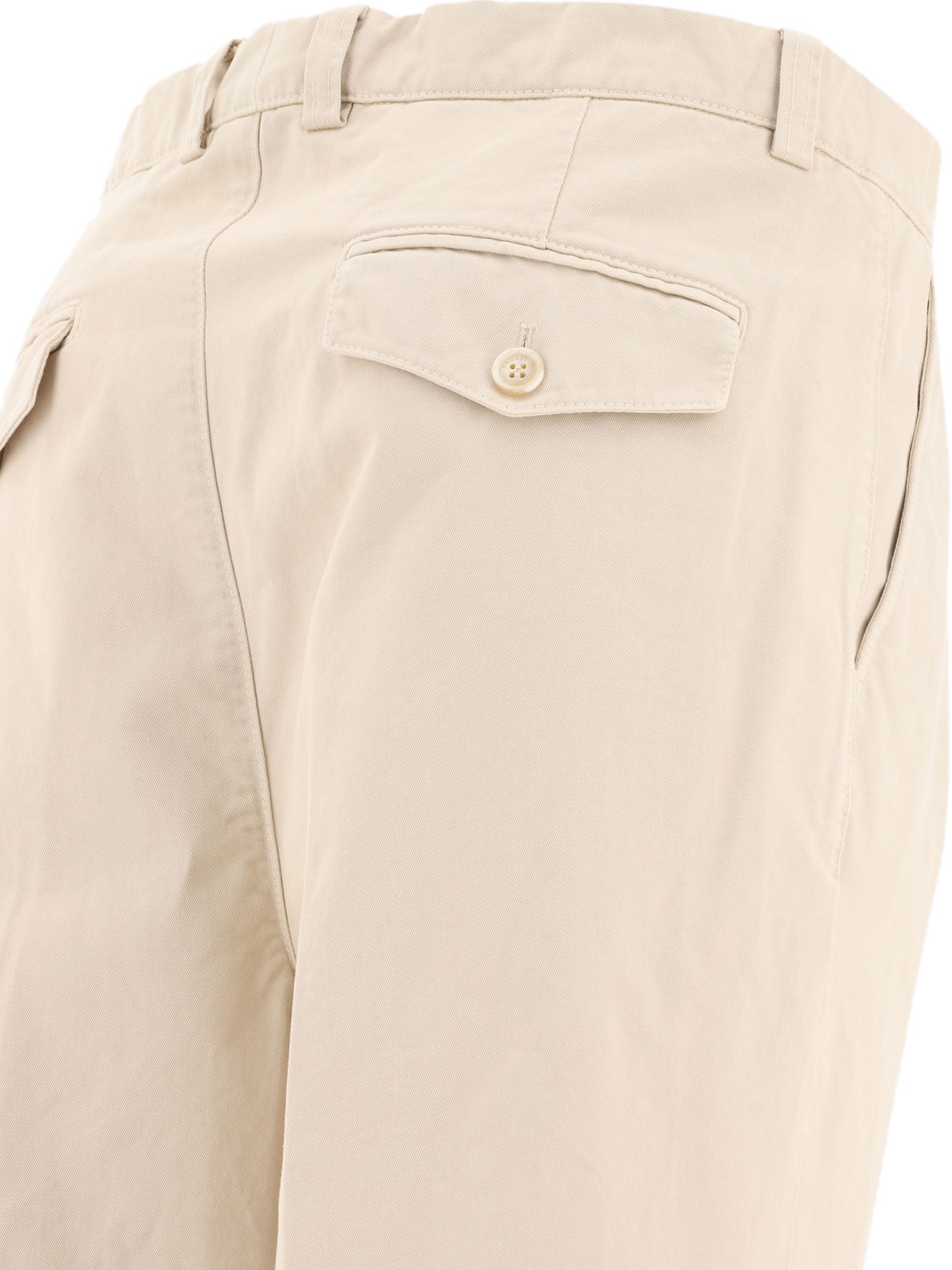 Trousers with reversed double pleats